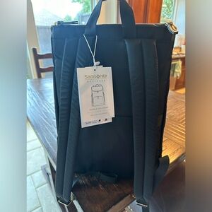 Samsonite Business Backpack. Black with gold zippers.  Brand new. Never used.